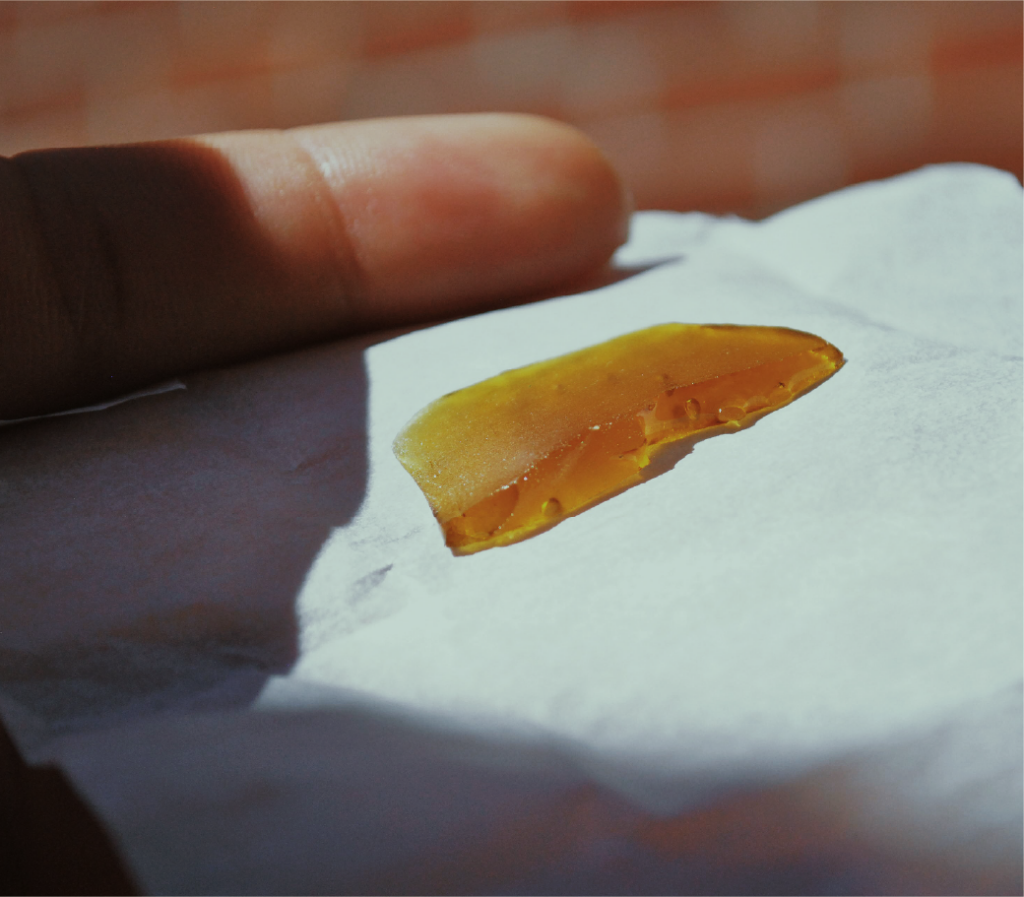 amber-colored concentrate om white piece of paper